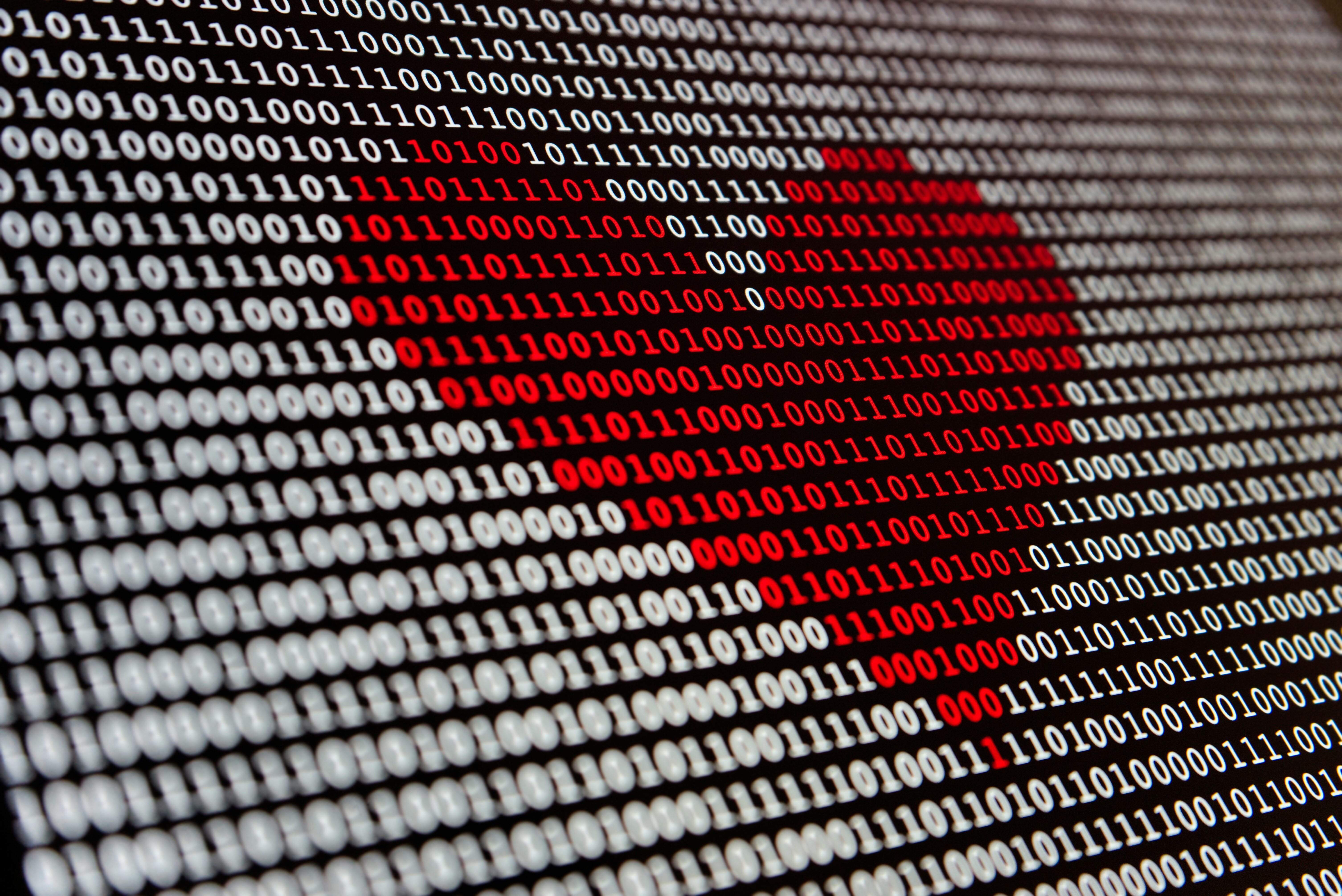 red heart on the binary code